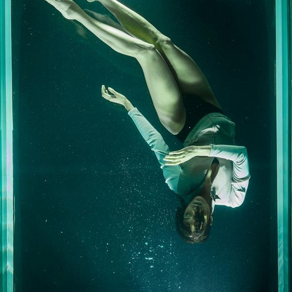 A person captured mid-movement, showing the fluidity of a pose.